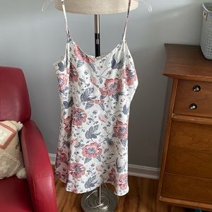 Selling a sleeveless cream color floral dress worn only once.